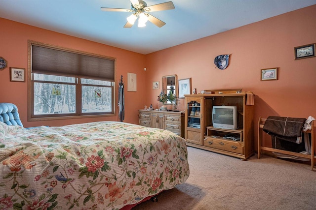 bedroom featuring light colored carpet and ceiling fan