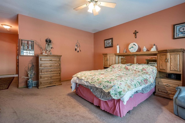 bedroom with light colored carpet and ceiling fan