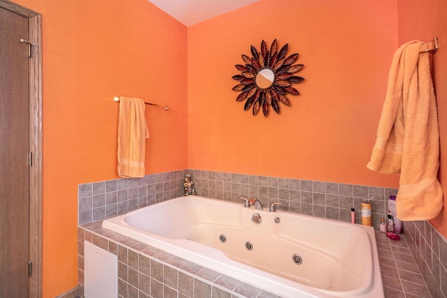 bathroom featuring a tub with jets