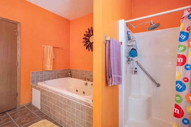 full bath with a jetted tub, a shower stall, and tile patterned flooring