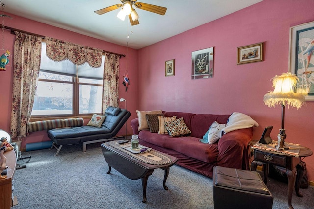 carpeted living area featuring ceiling fan