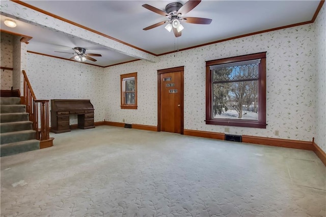 unfurnished living room featuring carpet floors, ornamental molding, stairway, and wallpapered walls