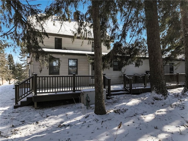 view of front of house with a garage and a wooden deck