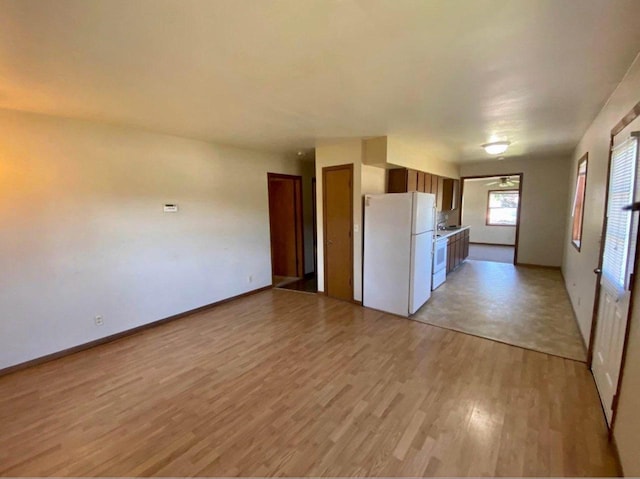 800 Thompson St, Portage, WI 53901 - kitchen with white appliances and light wood-type flooring