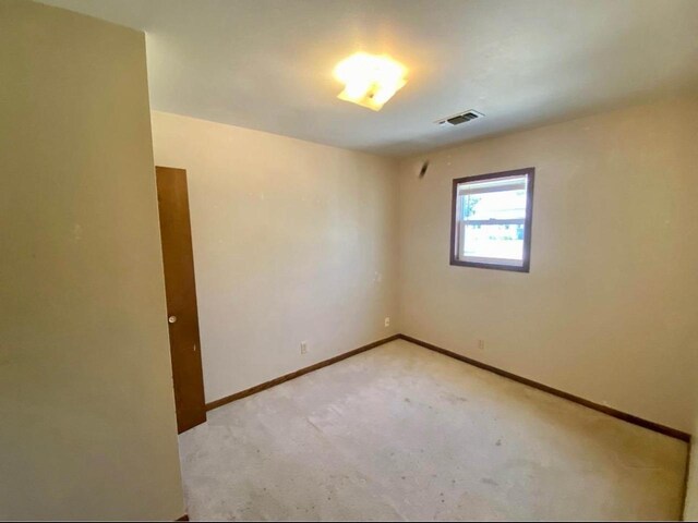 800 Thompson St, Portage, WI 53901 - spare room with baseboards and light colored carpet