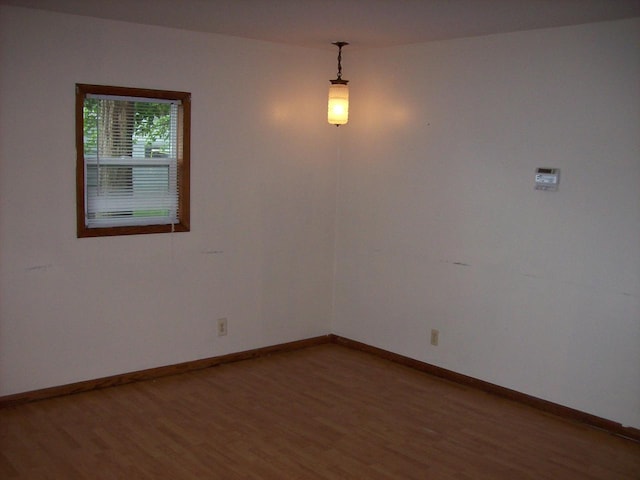 800 Thompson St, Portage, WI 53901 - empty room featuring light wood-style floors and baseboards