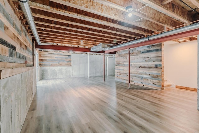 unfinished basement featuring wood finished floors