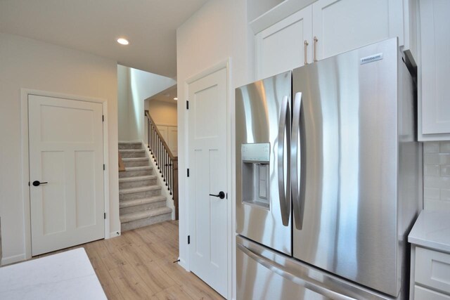 W198N5372 Boxwood Blvd, Menomonee Falls, WI 53051 - kitchen featuring stainless steel fridge, light wood-style floors, white cabinetry, recessed lighting, and light stone counters