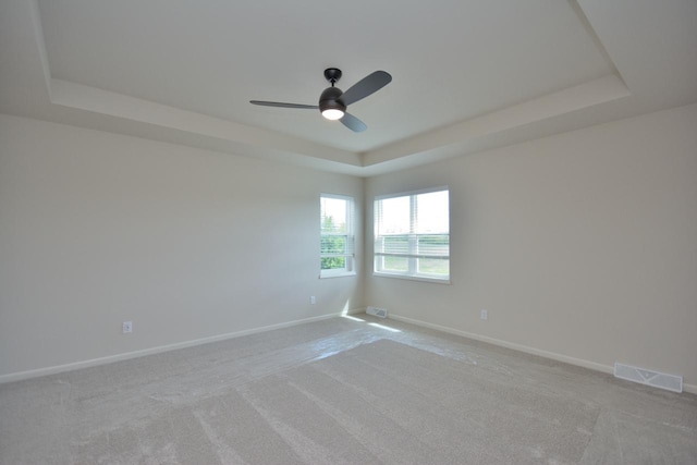 W198N5372 Boxwood Blvd, Menomonee Falls, WI 53051 - empty room with a raised ceiling, ceiling fan, light carpet, and baseboards