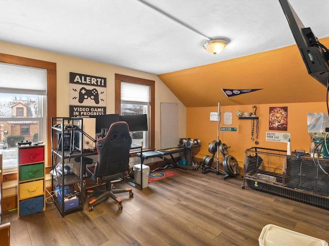 office area featuring vaulted ceiling and wood finished floors