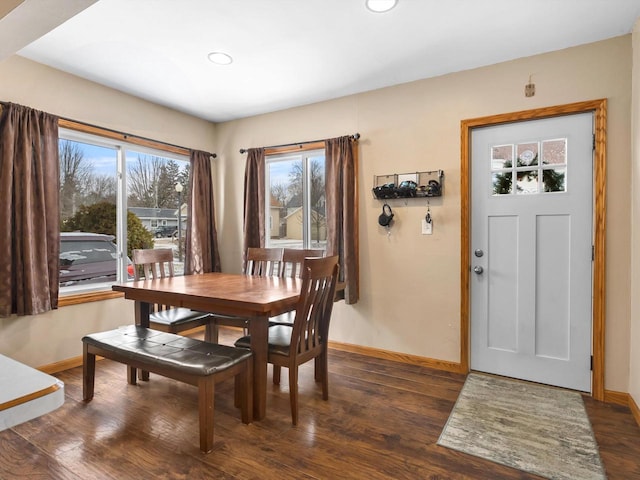 dining space featuring recessed lighting, baseboards, and wood finished floors