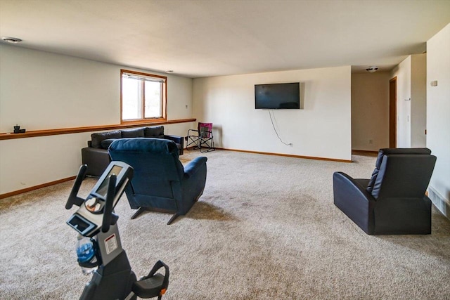 living area with baseboards and carpet