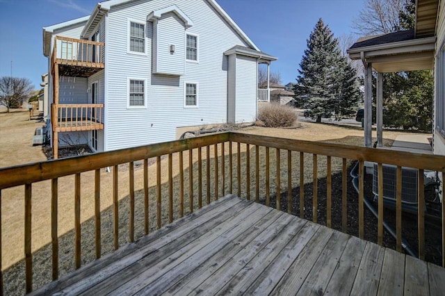 wooden terrace with a yard