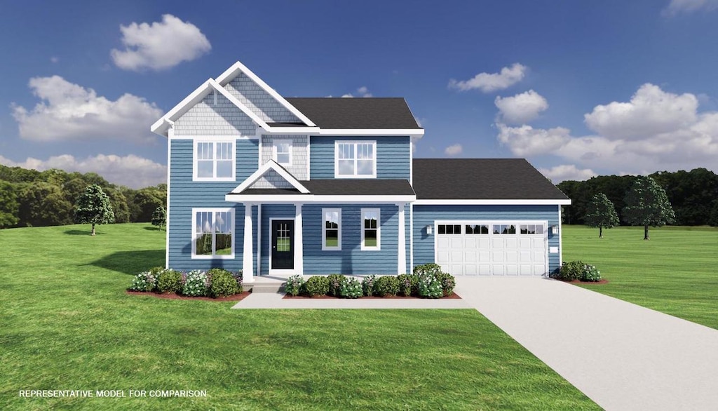 view of front of house featuring a garage, driveway, and a front yard