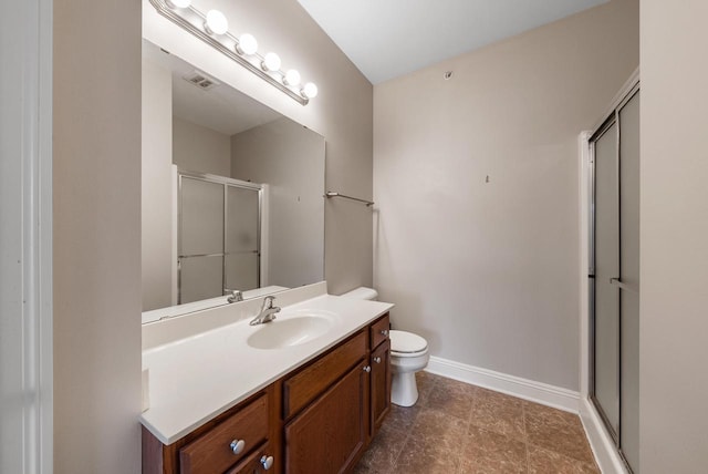 full bathroom with a stall shower, baseboards, visible vents, toilet, and vanity