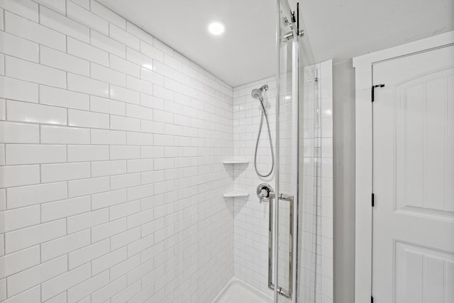 bathroom featuring a shower stall