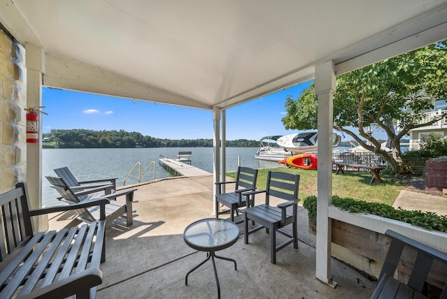 view of patio / terrace featuring a water view and a boat dock