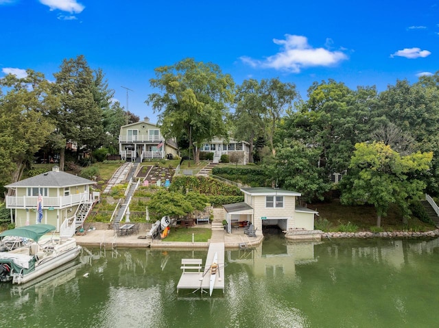 dock area featuring stairs and a water view