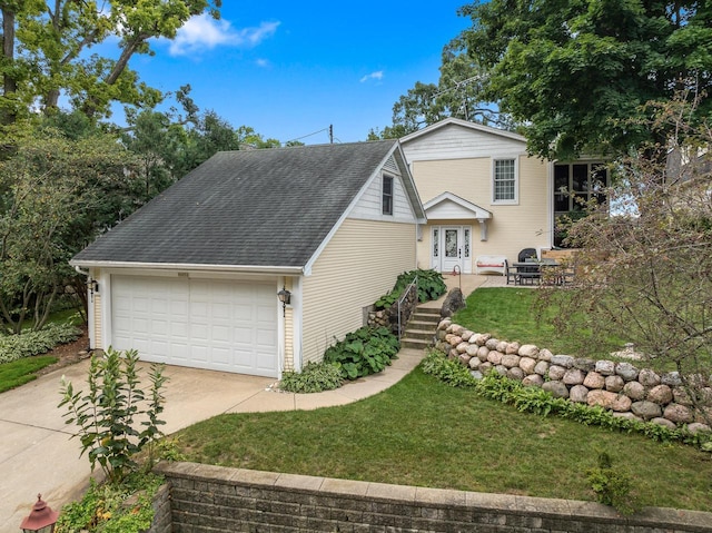 view of front of home featuring a garage, french doors, roof with shingles, and a front lawn