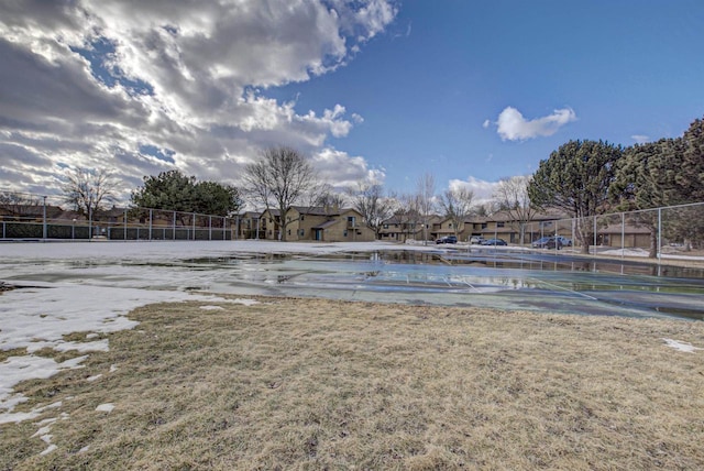 view of swimming pool with fence