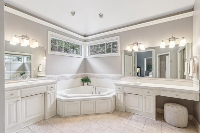 bathroom featuring a bath, tile patterned flooring, crown molding, and a sink