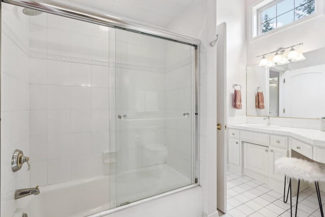 bathroom featuring shower / bath combination with glass door, vanity, and tile patterned floors