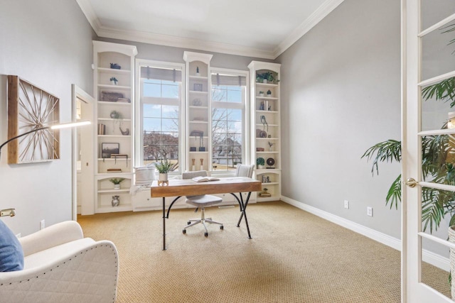 carpeted office with baseboards and crown molding