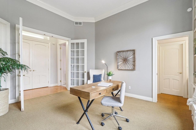 carpeted office featuring baseboards, visible vents, crown molding, and french doors