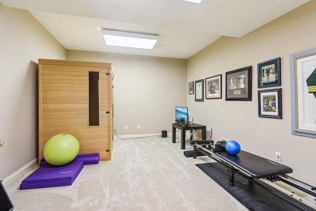 workout area with carpet and baseboards