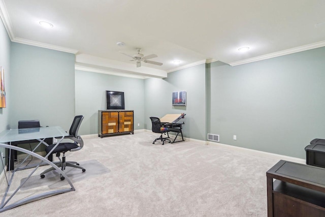 office area featuring crown molding, visible vents, a ceiling fan, carpet flooring, and baseboards