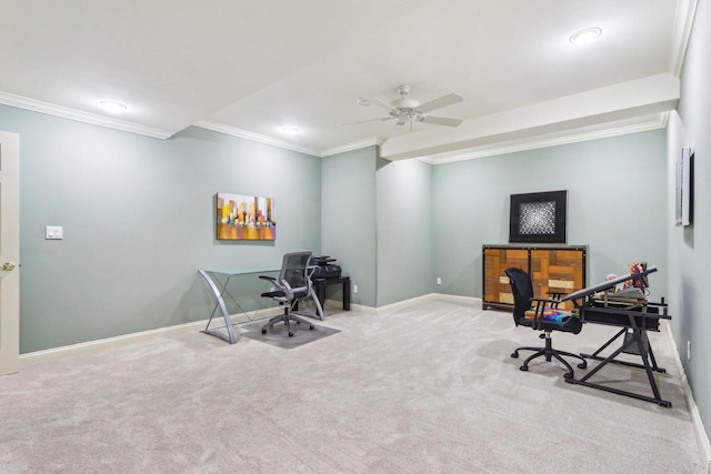 carpeted office with ornamental molding, a ceiling fan, and baseboards