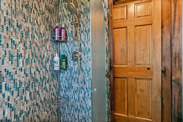 interior details with a tile shower