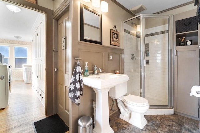 205 State St, Ripon, WI 54971 - bathroom featuring wainscoting, a shower stall, toilet, and a decorative wall
