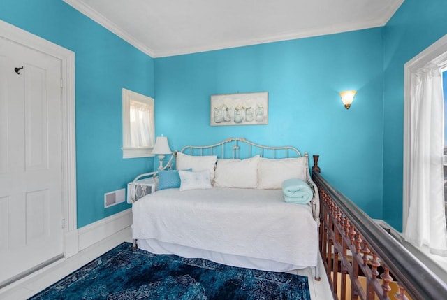205 State St, Ripon, WI 54971 - bedroom with visible vents, crown molding, and baseboards