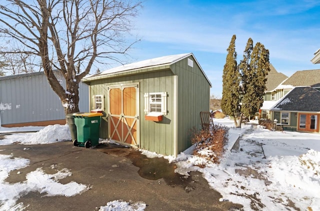 205 State St, Ripon, WI 54971 - snow covered structure with an outbuilding and a storage unit