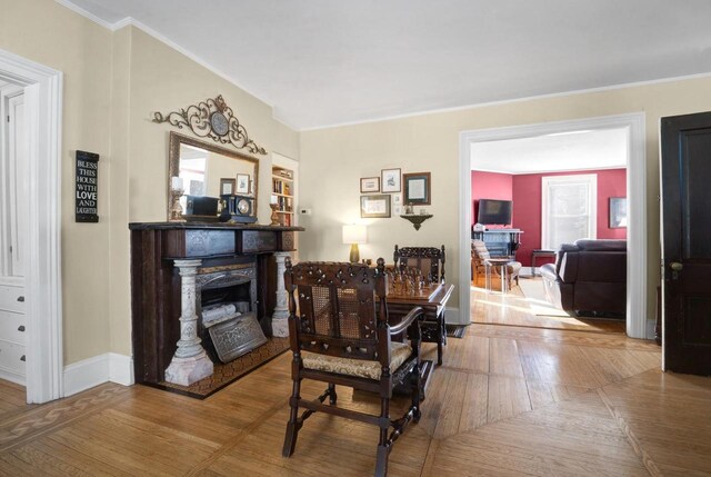 205 State St, Ripon, WI 54971 - dining room with parquet flooring, baseboards, a fireplace, and ornamental molding
