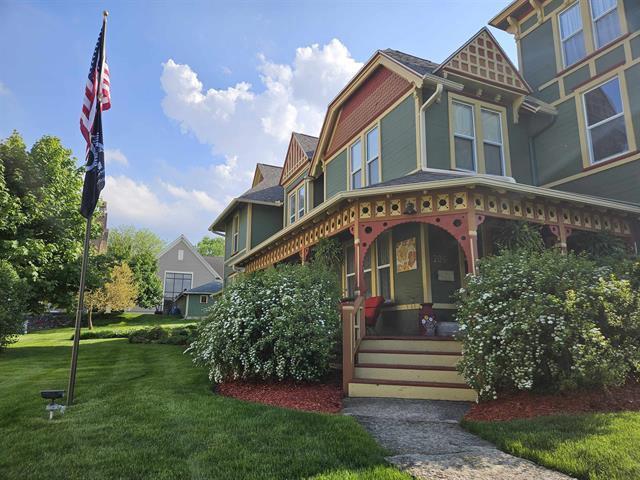 205 State St, Ripon, WI 54971 - victorian house featuring covered porch and a front yard