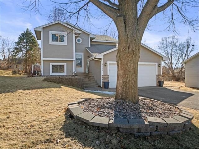 view of front of home featuring driveway and an attached garage