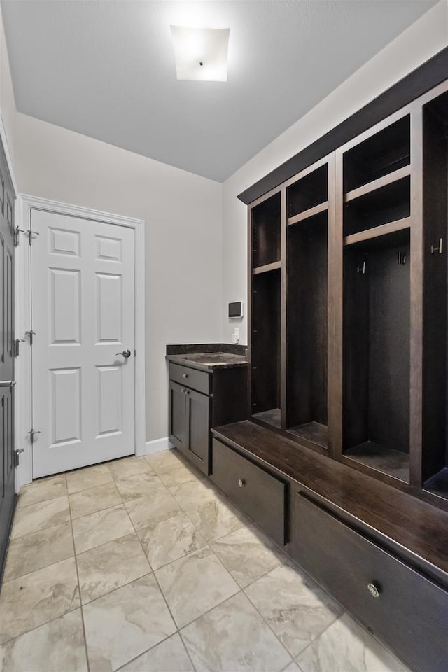 mudroom with marble finish floor