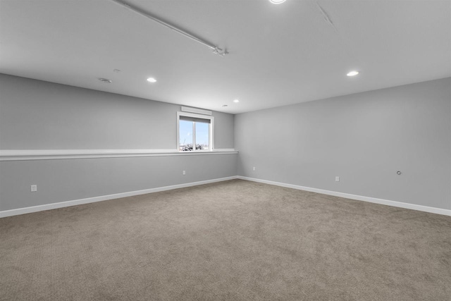 unfurnished room featuring recessed lighting, carpet flooring, and baseboards