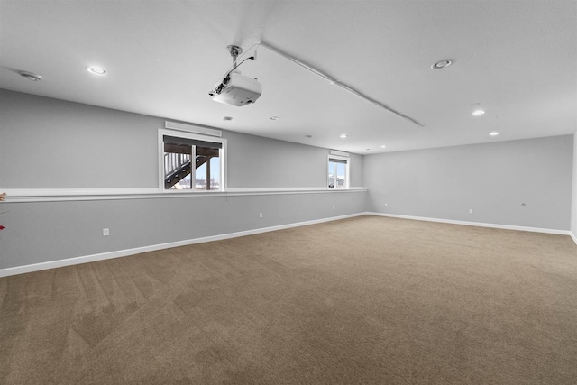 carpeted spare room with baseboards and recessed lighting