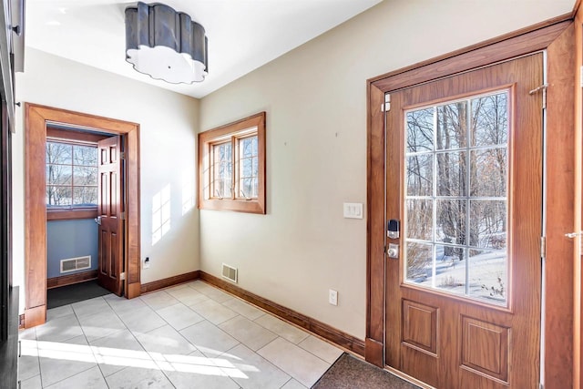 entryway featuring visible vents, baseboards, and light tile patterned floors