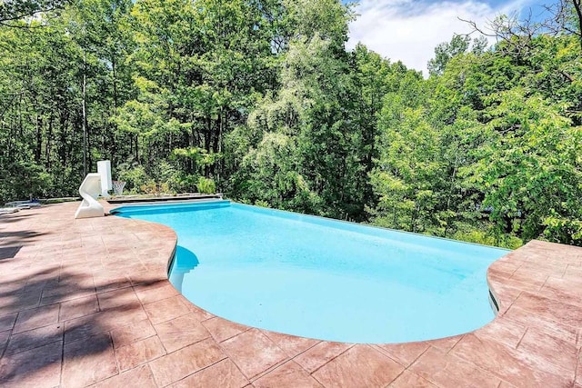 pool with a patio