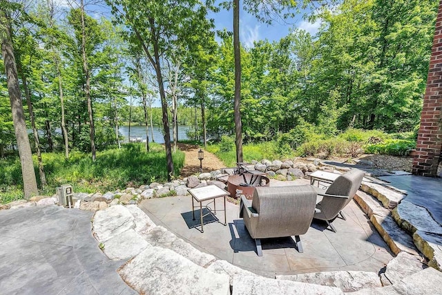 view of patio / terrace featuring a water view