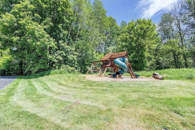 view of play area featuring a lawn