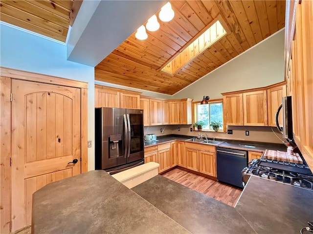 kitchen featuring dark countertops, light brown cabinetry, appliances with stainless steel finishes, a sink, and wooden ceiling