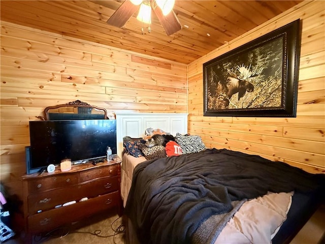 bedroom featuring wooden ceiling and wood walls