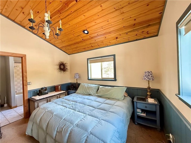 tiled bedroom with lofted ceiling, wooden ceiling, and wainscoting