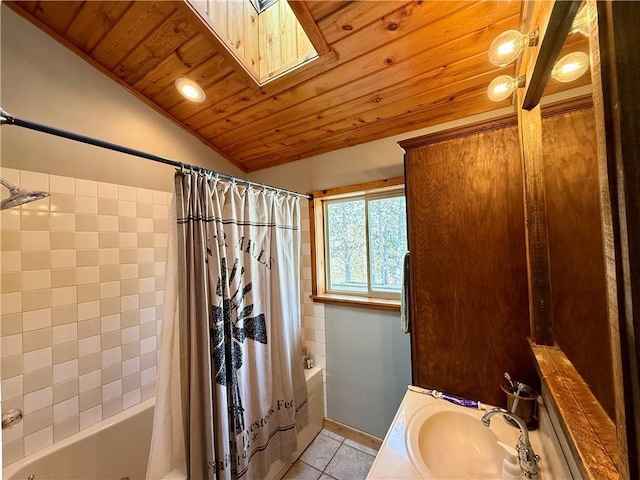 full bath with vaulted ceiling with skylight, shower / bath combo, wood ceiling, tile patterned flooring, and vanity