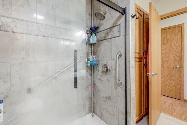 bathroom with a shower stall